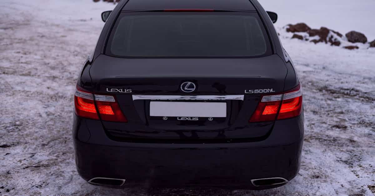 rear-view-of-a-black-lexus-ls-600h-parked-on-snow-showcasing-luxury-in-a-winter-setting